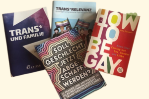 Infobroschüren und ein Buch zum Thema trans* Kind